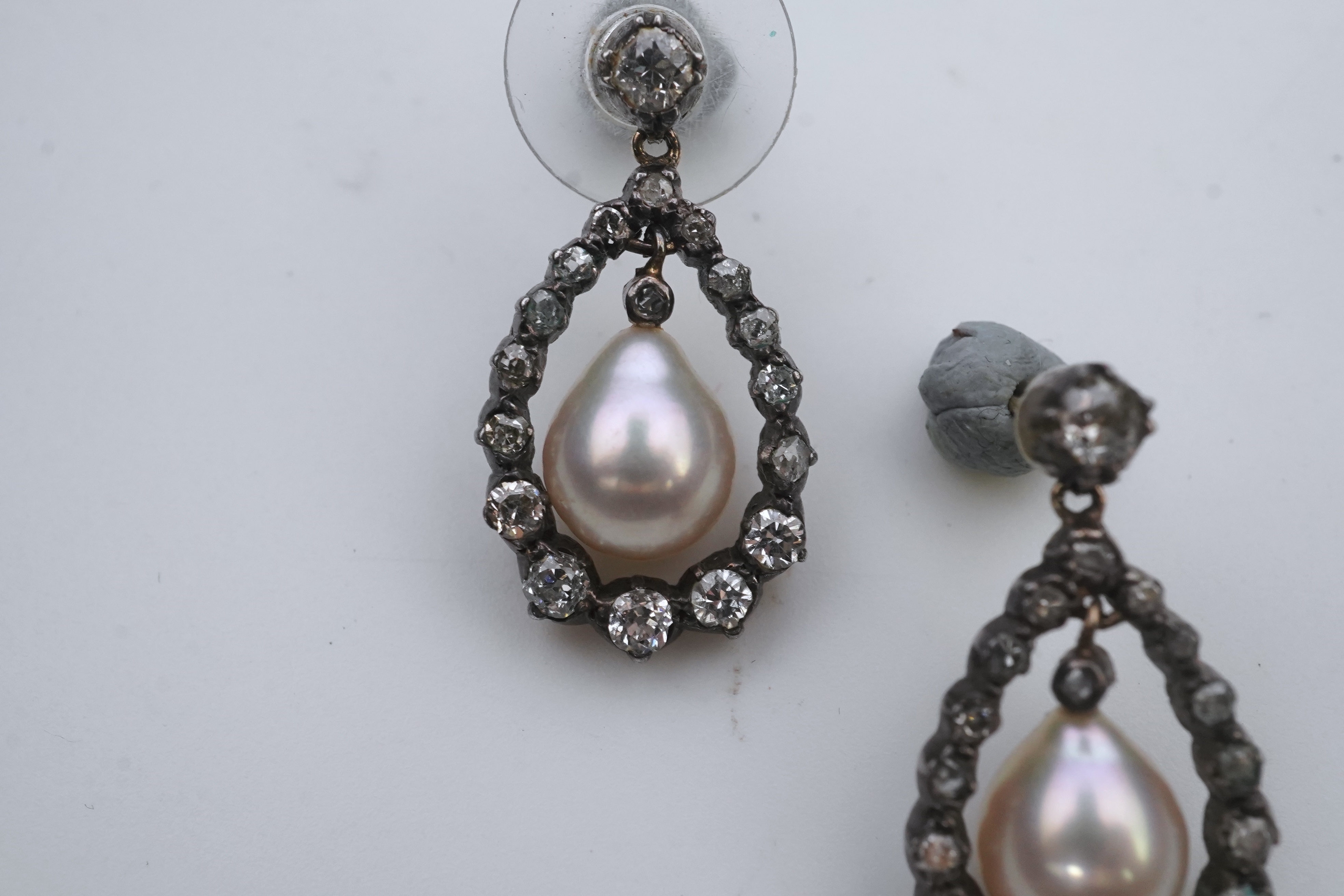 A pair of cultured pearl and diamond earrings